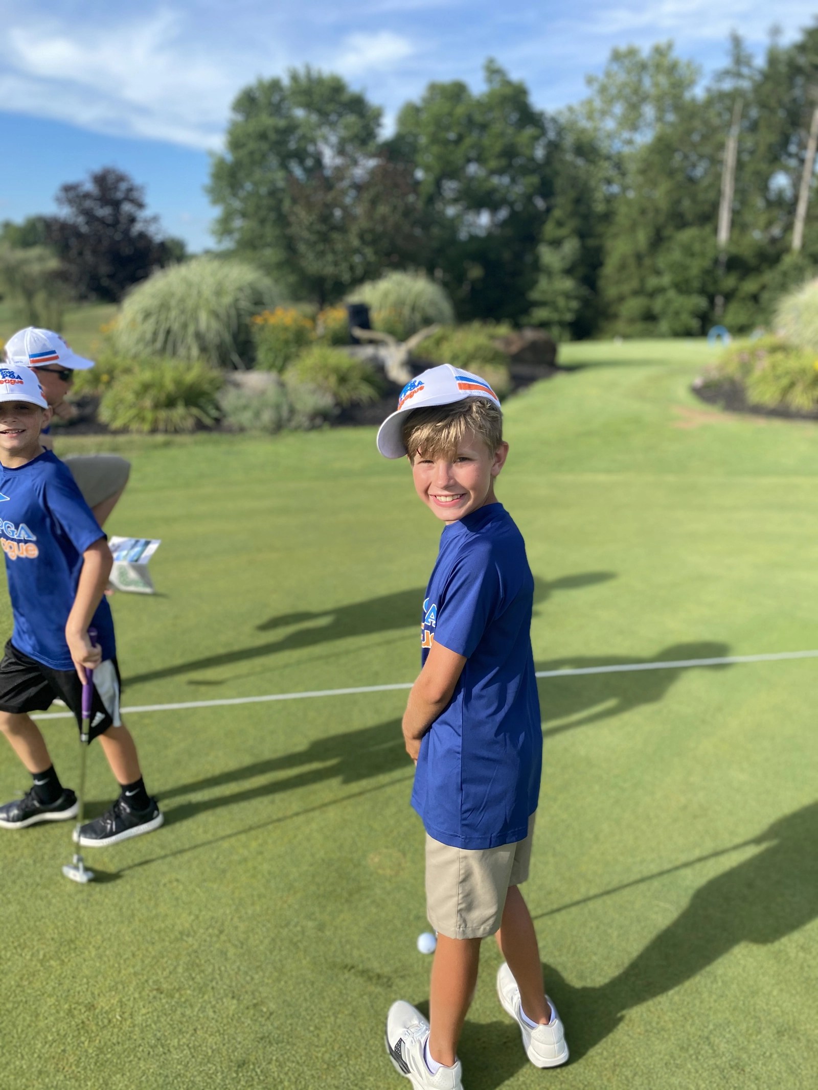 Junior golfer putting