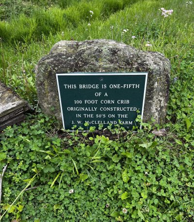 Sign explaining the historic corn crib bridge at EagleSticks Golf Club