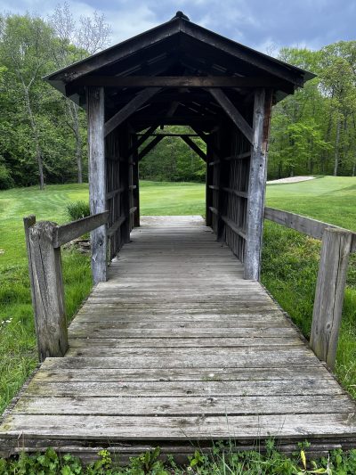 covered walking bridge made from 11 foot corn crib used on the farm that became EalgeSticks Golf Club