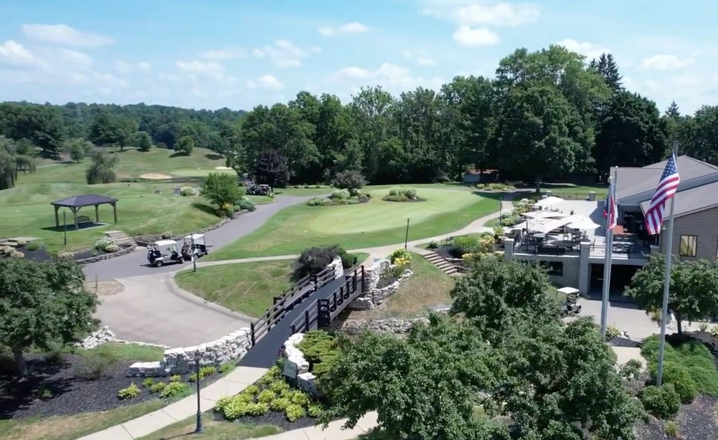 EagleSticks Golf Club clubhouse aerial with American flag